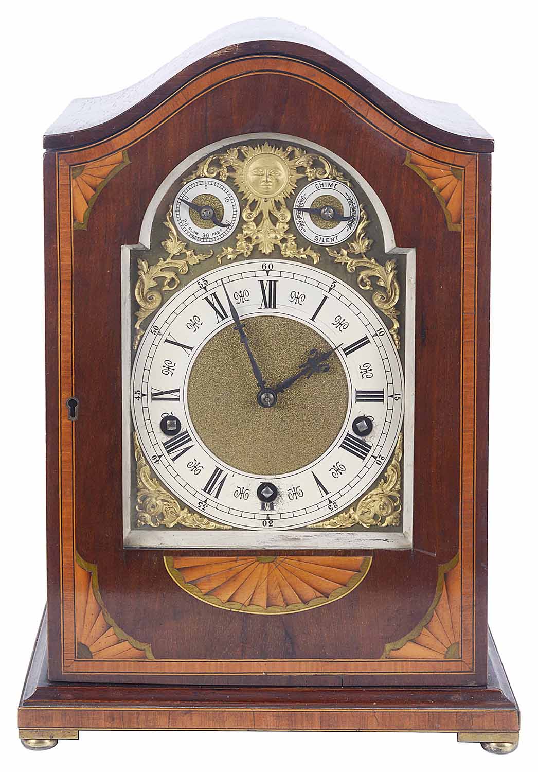 A German mahogany and satinwood chiming table clock