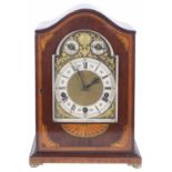 A German mahogany and satinwood chiming table clock