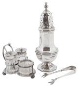 A silver sugar sifter, sugar nips and condiment trio