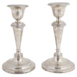 A pair of Edwardian silver candlesticks, hallmarked Birmingham 1908