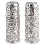 A pair of Victorian silver pepperettes, hallmarked London 1890