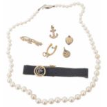 A graduated cultured pearl necklace together with various charms