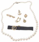 A graduated cultured pearl necklace together with various charms