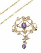 An Art Nouveau amethyst and seed pearl scroll pendant brooch on chain