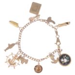 A delicate 9ct gold charm bracelet suspended with various gold charms