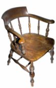 An elm smoker's bow armchair, 20th century