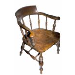 An elm smoker's bow armchair, 20th century