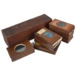 A large collection of wooden mounted magic lantern slides