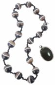 A Victorian banded agate bead necklace and oval pendant