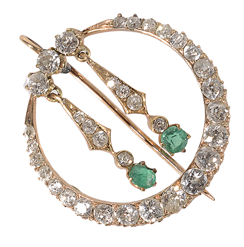 A delicate early 20th century diamond and emerald pendant brooch