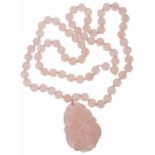 A Chinese rose quartz carved pendant necklace