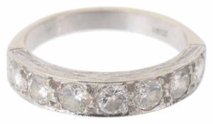 A Continental seven stone diamond set half eternity ring