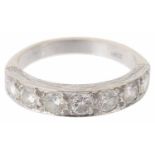 A Continental seven stone diamond set half eternity ring