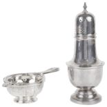 A George V silver sifter and a silver tea strainer spoon with bowl