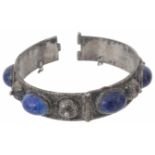 A Persian white metal hinged bracelet