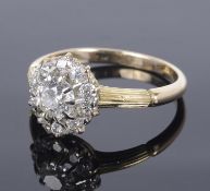 A delicate Edwardian diamond set daisy cluster ring