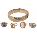 A collection of four gold mounted dress rings