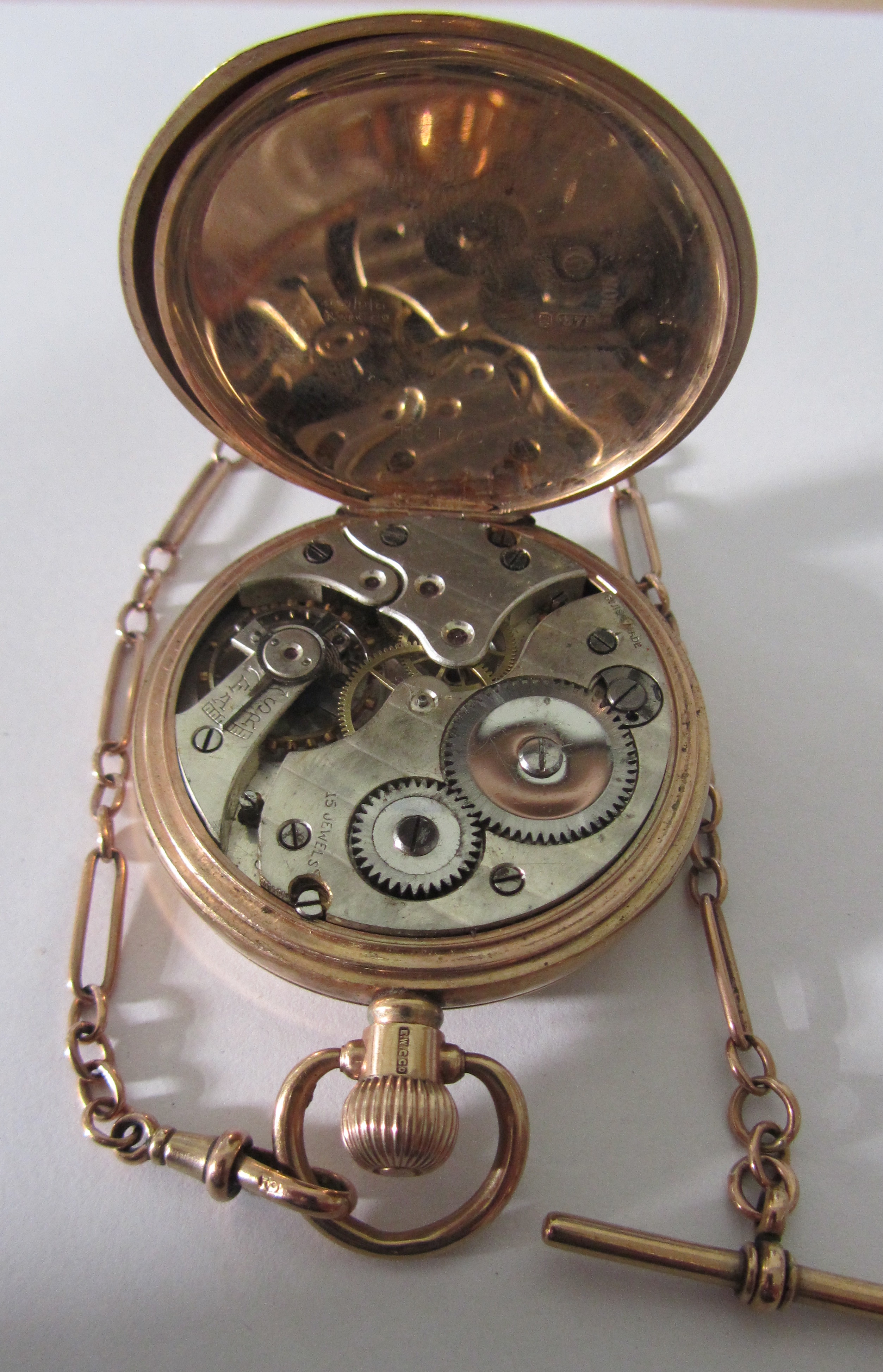 A 9ct rose gold open faced pocket watch; Albert watch chain - Image 5 of 7