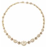 An attractive Victorian pearl set crescent and star necklace