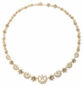 An attractive Victorian pearl set crescent and star necklace