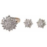 A diamond set cluster ring and matching earrings
