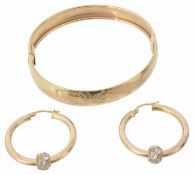 A contemporary 9ct gold hinged bangle; pair of gold hoop earrings