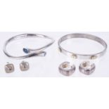 A small collection of silver modernist jewellery including bangles