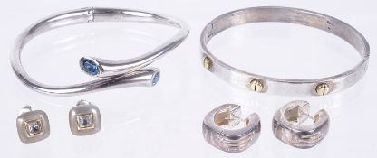 A small collection of silver modernist jewellery including bangles