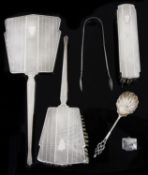 An Art Deco three piece silver dressing table brushes; others