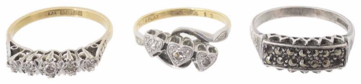 A triple diamond set heart ring and two other rings