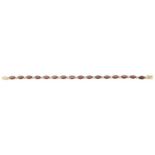 A delicate Continental 18K gold garnet set bracelet