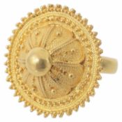 An Ethiopian yellow metal circular shield ring