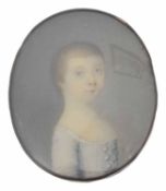 A portrait miniature of a young woman on ivory