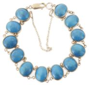 A Continental turquoise cabochon set panel bracelet