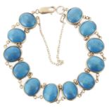 A Continental turquoise cabochon set panel bracelet