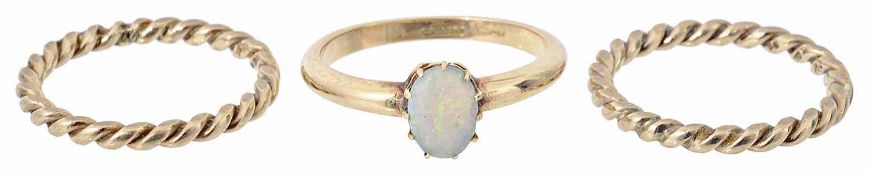 A single stone opal set ring together with a pair of twist rings