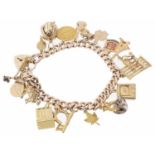A 15ct rose gold charm bracelet; 9ct gold heart padlock fastening