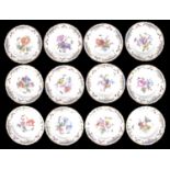 A suite of twelve KPM porcelain plates, late 19th century