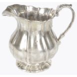 A Victorian Irish silver cream jug, hallmarked Dublin 1823