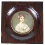 A late 19th century portrait miniature of a young woman on ivory