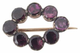 A small Georgian flat cut garnet set oval brooch