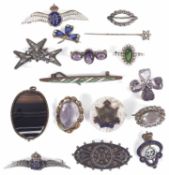 A small collection of costume brooches