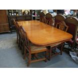 REPRODUCTION YEW WOOD EXTENDING DINING TABLE AND SIX CHAIRS