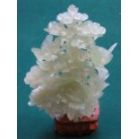 HEAVILY CARVED ORIENTAL STYLE JADE COLOURED TREE FORM FIGURE WITH MYTHICAL BIRDS ON WOODEN STAND,
