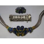 EGYPTIAN SILVER COLOURED BRACELET AND CHINESE SILVER COLOURED AND ENAMELLED BELT PLUS MATCHING CLIP