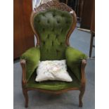 CARVED FRAMED GREEN UPHOLSTERED BUTTON BACK ARMCHAIR