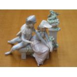 NAO GLAZED CERAMIC SEATED FIGURE GROUP,