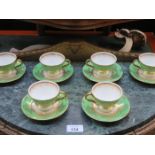 SET OF SIX COALPORT GILDED CUPS AND SAUCERS