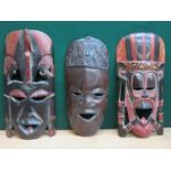 THREE TRIBAL STYLE TREEN WALL MASKS