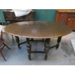 CARVED OAK GATELEG DINING TABLE